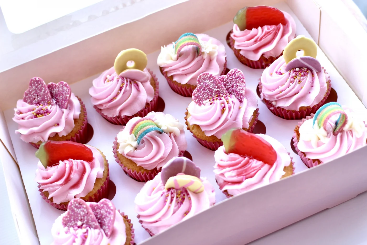 A selection of pink strawberry cupcakes